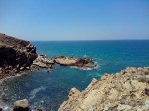 a view of the ocean from a cliff at Marina golf Assila in Asilah