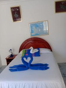 Voodi või voodid majutusasutuse Hostal Insular toas