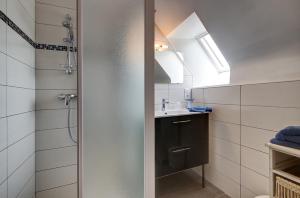 a bathroom with a shower and a sink at A la Ferme de Kervihern in Locoal-Mendon +27 photos