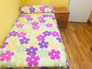 A bed or beds in a room at Pensión la Estación