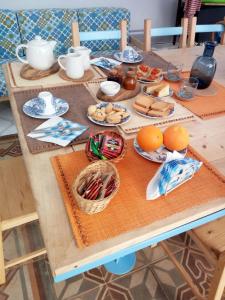 a wooden table with food on top of it at B&B La Gufa in Cisternino