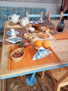 a wooden table with food on top of it at B&B La Gufa in Cisternino