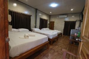 Letto o letti in una camera di Baan Khue Wieng Resort