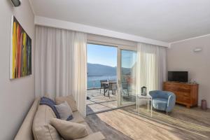TV a/nebo společenská místnost v ubytování La Dolce Vita Relais - Hotel Gallo
