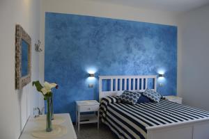 Postel nebo postele na pokoji v ubytování Levante Blu