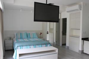 Postel nebo postele na pokoji v ubytování O local para o seu lazer