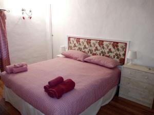 A bed or beds in a room at Il Gallo Del Vicino