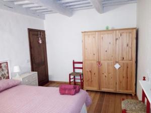 A bed or beds in a room at Il Gallo Del Vicino