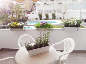 Der Swimmingpool an oder in der Nähe von Cozy Loft Torremolinos