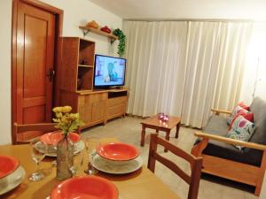 TV a/nebo společenská místnost v ubytování LOS IRIS PLAYA DE GANDIA- Apartamento Familiar