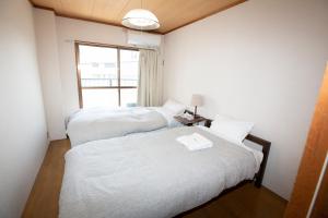 Postel nebo postele na pokoji v ubytování Lazy House