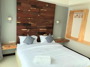 Postel nebo postele na pokoji v ubytování Nan Panwa Hotel