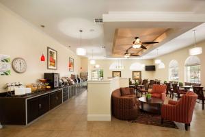 a lobby of a hotel with a restaurant at Wingate by Wyndham San Marcos in San Marcos