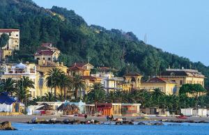 a group of buildings on a beach next to the water at Grottammare mon amour Ponente in Grottammare