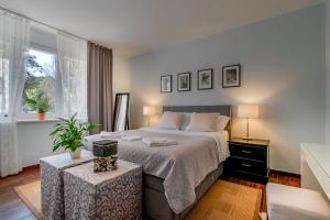 Postel nebo postele na pokoji v ubytování Adriatic Apartments