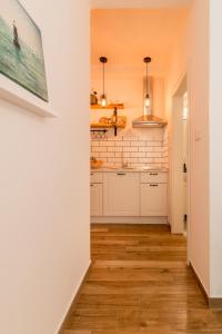 Kuchyň nebo kuchyňský kout v ubytování Adriatic Apartments