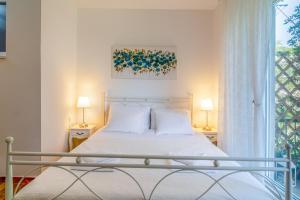Postel nebo postele na pokoji v ubytování Adriatic Apartments