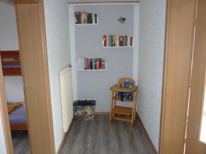 a small room with bookshelves on the wall at Haus Maria in Olmscheid
