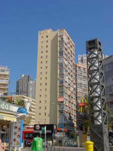 a tall building in a city with tall buildings at Apartamentos Las Carabelas in Benidorm