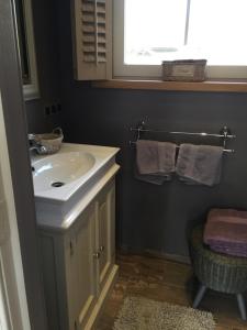 a bathroom with a white sink and a window at BB-hof ter boone in Kapelhoek +76 photos