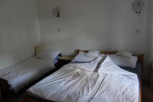 Postel nebo postele na pokoji v ubytování Guest House 3M