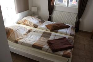 Ein Bett oder Betten in einem Zimmer der Unterkunft Zimmervermietung Heggemann