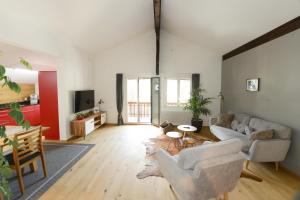 a living room with a couch and a table at Zer Treichi Appartements in Fiesch