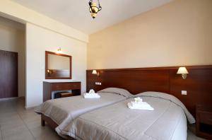 Postel nebo postele na pokoji v ubytování Hotel El Greco