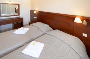 Postel nebo postele na pokoji v ubytování Hotel El Greco