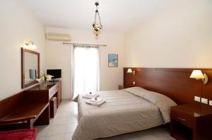 Postel nebo postele na pokoji v ubytování Hotel El Greco