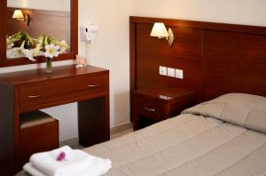 Postel nebo postele na pokoji v ubytování Hotel El Greco