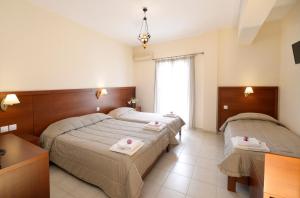 Postel nebo postele na pokoji v ubytování Hotel El Greco