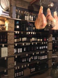 a store filled with lots of bottles of wine at Locanda-Trattoria Al Rio in Cinto Euganeo