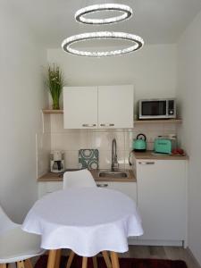 Kuchyň nebo kuchyňský kout v ubytování Gästezimmer Resi + 15 fotografií