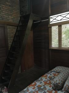 En eller flere senge i et værelse på Villa Diantie