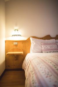 Postel nebo postele na pokoji v ubytování Albergo Vezzana