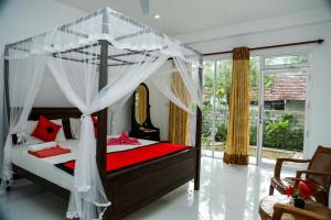 Ένα ή περισσότερα κρεβάτια σε δωμάτιο στο One-plus Holiday Homes Mirissa