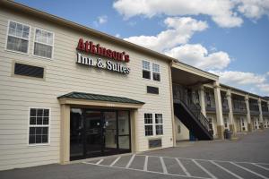 an entrance to an antioch inn and suites at Atkinson Inn & Suites in Lumberton