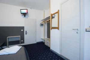 Rúm í herbergi á Hotel Rubino
