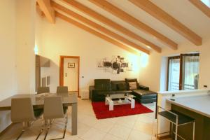 a living room with a couch and a table at Il Castello in Pergine Valsugana