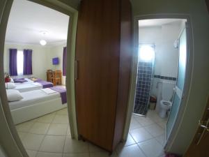 Postel nebo postele na pokoji v ubytování Hotel Bicaj