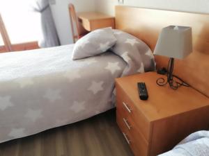 Postel nebo postele na pokoji v ubytování Hostal Santa Clara