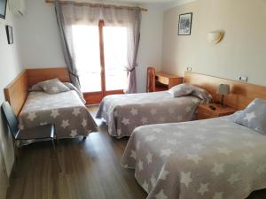 Postel nebo postele na pokoji v ubytování Hostal Santa Clara