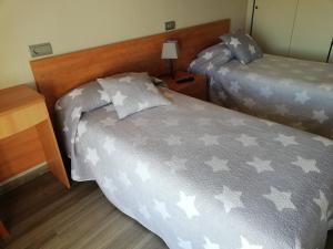 Postel nebo postele na pokoji v ubytování Hostal Santa Clara