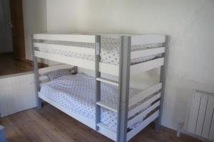 a couple of bunk beds in a room at La Maisonnette de la Plage du Rouet in Carry-le-Rouet