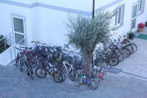 a bunch of bikes parked next to a building at Hotel Bicaj in Shkodër