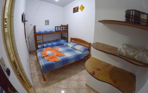 Tempat tidur dalam kamar di Pousada e Hostel Chapada Suites