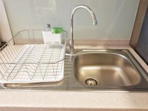 a kitchen sink with a metal sink at Astra Suites Night Bazaar in Chiang Mai +54 photos