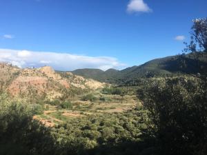 
a mountain range with trees and mountains at Posada Manolon in Santa Cruz de Moya
