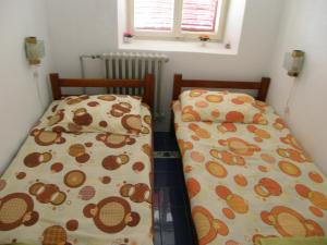 two beds sitting next to each other in a room at Stone House in Buljarica in Petrovac na Moru